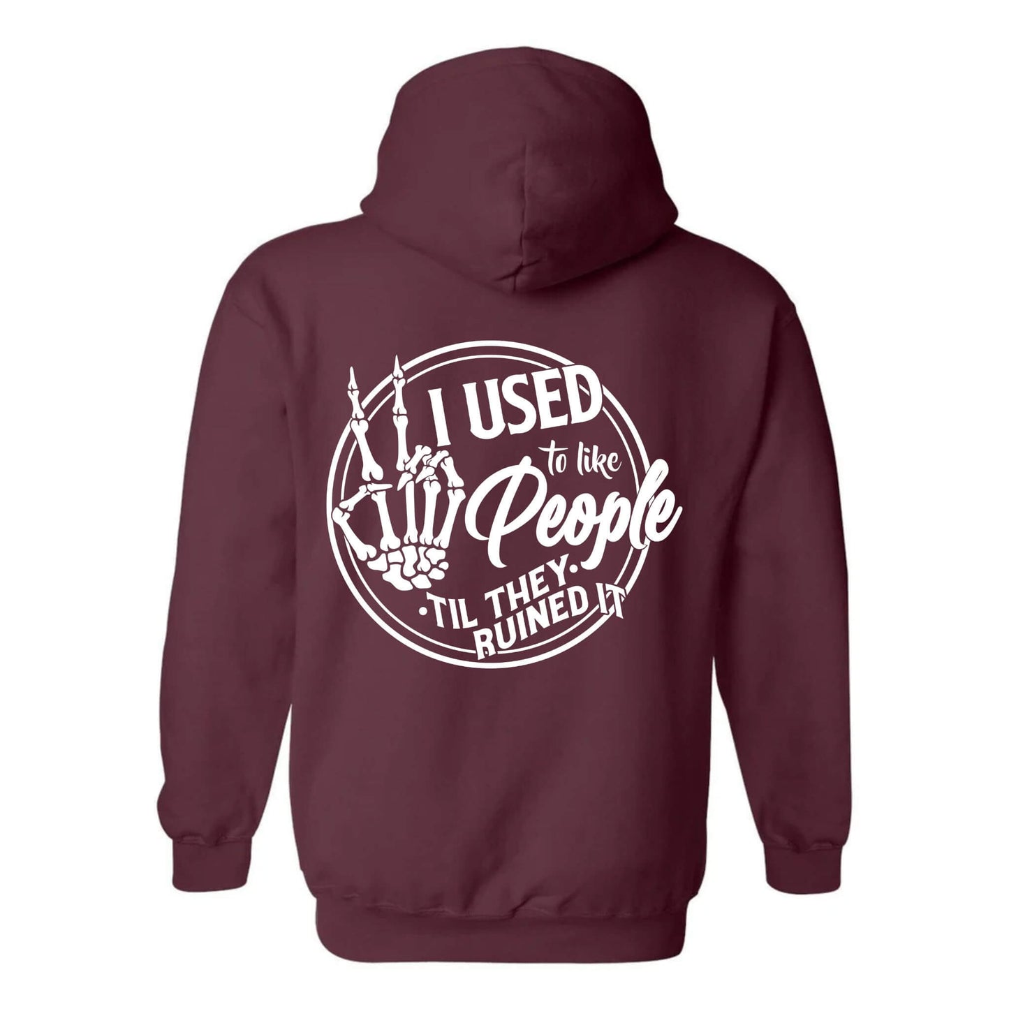 A maroon hoodie with a printed phrase 'I Used to Like People' on the back, featuring a cheeky skeleton hand design.